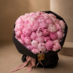 61 premium peonies arranged in a classic glass vase for Monaco delivery