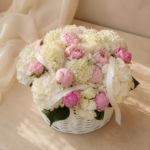 Front view of the Pure Cloud basket with white hydrangeas and pink peonies