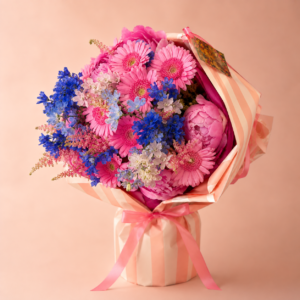Seasonal Compliment seasonal flower bouquet Monaco with peonies and delphiniums