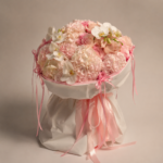 Powder pink hydrangea and English rose bouquet with white orchids