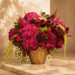 Crimson Medusa luxury exotic flower arrangement in gold vase by Saint Barbara Flowers