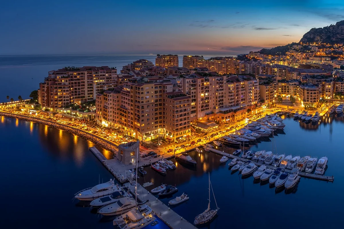 Evening view of Monaco harbour and luxury yachts
