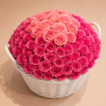 300 pink roses dome in white wicker basket by Saint Barbara Flowers