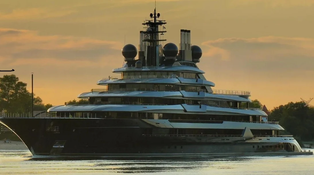 Luxury superyacht at sunset representing bespoke yacht flowers and floral styling in Monaco